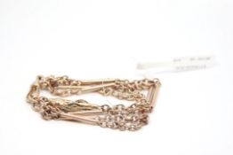 Rose metal bracelet, three rows of alternating chain and bar links, and tassel detail to the