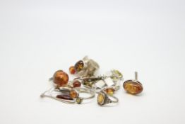 A quantity of mostly silver jewellery including Amber set rings, weighing approximately 44g gross