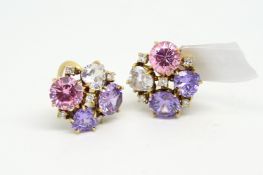 Stone set ear clips, set with pink, purple and colourless stones and diamond detail, mounted in