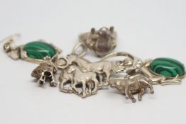 Selection of mainly silver animal jewellery including horse pendants, frog pendants, a frog ring and