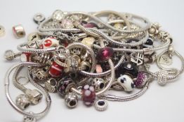 Silver charm bracelets and charms including Chamilia and Rhona Sutton, gross weight approximately