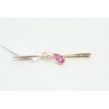 Gem set bar brooch, set with a pear and round cut pink stone, mounted in 9ct yellow gold