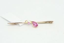 Gem set bar brooch, set with a pear and round cut pink stone, mounted in 9ct yellow gold