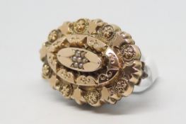 Antique seed pearl brooch, cluster of seed pearls to the centre, with an ornate carved surround,