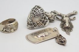 Selection of mainly silver jewellery including a 'Spiderman' ring, a ram pendant and a wolf pendant,