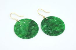 Pair of diamond and jadeite earrings, circular jadeite discs, set with five brilliant cut diamonds