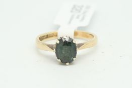 Single stone tourmaline ring, oval cut green tourmaline, eight claw set in 9ct yellow gold,