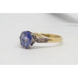 Sapphire ring, central old cut sapphire, measuring 8.1 x 6.8mm, claw set in yellow and white