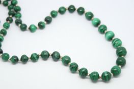 Malachite bead necklace, graduated malachite beads measuring 7.5 - 12mm, each separated by a metal