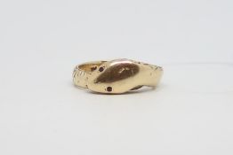 Snake head ring, garnet set eyes, engraved body detail, stamped and tested as 9ct, ring size R