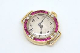 Ladies' ruby and diamond watch, circular dial with Arabic numerals, with a French cut ruby and round