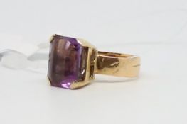 Single stone ring, rectangular step cut amethyst, measuring 13 x 11mm, in 18ct yellow gold,