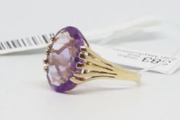 Single stone ring, oval cut amethyst measuring 16 x 12mm, claw set in 9ct yellow gold, ring size O