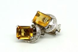 Citrine and diamond earrings, rectangular step cut citrine with a diamond set semi-circle above,