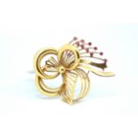 Ruby bow brooch, yellow metal fancy bow, set with a spray of eleven round cut rubies, stamped 750,