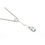 Aquamarine and seed pearl necklace, pear shaped aquamarine, suspended from a seed pearl set bar, and