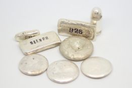 Selection of silver nuggets and a silver bullet pendant, gross weight approximately 210 grams