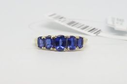 Five stone synthetic sapphire ring, five graduated oval cut synthetic sapphires, claw set in 9ct