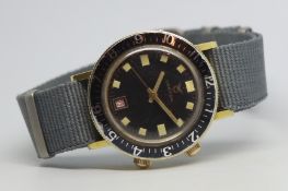 Vintage Croton divers alarm wristwatch, circular black dial with oversized luminous markers, outer