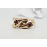 Garnet set double snake head ring, cross over snakes with rose cut garnets, engraved detail, in