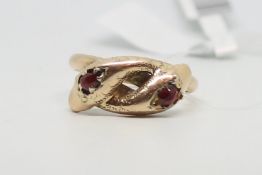 Garnet set double snake head ring, cross over snakes with rose cut garnets, engraved detail, in