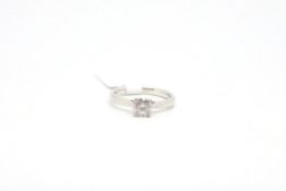 Single stone diamond ring, round brilliant cut diamond weighing an estimated 0.65ct, four claw set