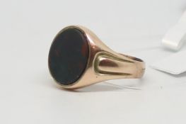 Blood stone set signet ring, oval cut blood stone set in a rose gold mount, stamped and tested as