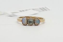 Opal and blue stone three stone ring, claw set, yellow gold band stamped 9ct, stamped Fidelity, ring