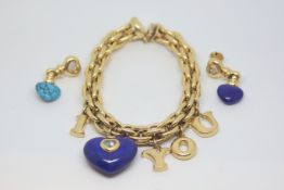 Chopard charm bracelet and earring set, heavy gold link bracelet with gold charms, large carved