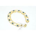 18ct gold bracelet, ten circular links set with motifs in the design of the Turkish 'All seeing