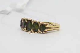 Green Tourmaline and diamond five stone carved half hoop ring, five graduating green tourmaline