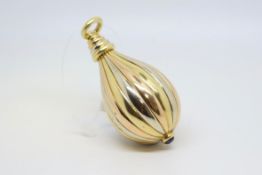 A tri-colour gold and sapphire set pendant, large pear drop pendant with cabochon sapphire, in