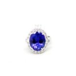 Tanzanite and diamond cluster ring, central oval cut tanzanite, weighing an estimated 9.09ct, with a