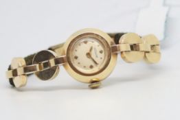 Ladies' LeCoultre 14ct Gold Cocktail Watch, ciruclar white dial with gold hour markers, 14ct gold