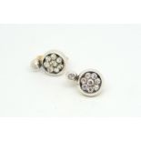 Diamond set earrings, old cut diamond rubover set, suspending a eight stone old cut diamond cluster,