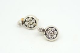 Diamond set earrings, old cut diamond rubover set, suspending a eight stone old cut diamond cluster,