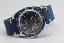 Vintage Kelton Divers watch, circular blue dial with baton hour markers, outer minute track, date