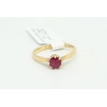 Single stone ruby ring, round cut ruby, eight claw set in yellow metal, tested as 18ct with
