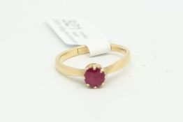 Single stone ruby ring, round cut ruby, eight claw set in yellow metal, tested as 18ct with