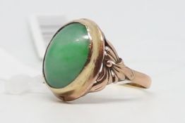 Vintage Chinese jade ring, cabochon cut jadeite collet set, measuring approximately 15.5 x 11.5mm,