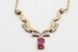 Ruby and diamond wishbone necklace, integrated chain stamped and tested as 9ct