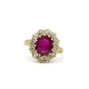 Ruby and diamond cluster ring, oval cut ruby weighing an estimated 2.50ct, surrounded by old cut