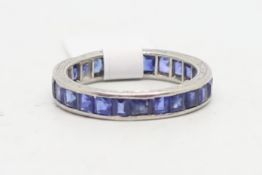 Art Deco sapphire full eternity ring, channel set with square cut sapphires, mounted in platinum