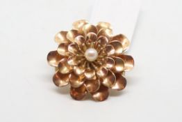 15ct pearl set flower brooch, three rows of rotating petals, 21mm diameter, pin and c clip