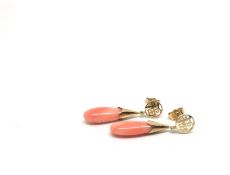 A pair of coral earrings, drops of rep/pink coral suspended from Chinese character tops, post and