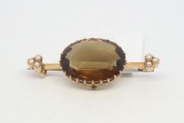 Citrine and pearl brooch, 22x16mm oval cute citrine, claw set, knife edge bar with a trefoil of