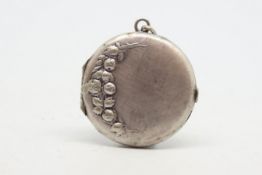 A vintage silver locket, circular design depicting fruit and leaves