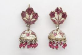 Four pairs of earrings, including a pair of enamel chandelier earrings with ruby bead drops, a