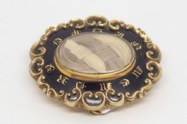 Victorian mourning brooch, black enamel 'In Memory Of' frame, woven hair centre, back engraved '