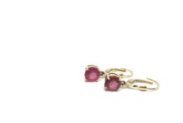 A pair of ruby drop earrings, round cut rubies, mounted in four claw settings, hinged hoop fittings,